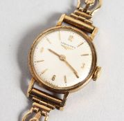 A LADIES' 9CT GOLD LONGINES WRISTWATCH with 9ct gold bracelet, in a box.