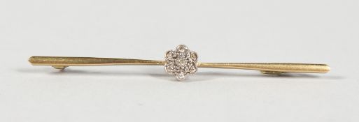 A GOLD AND DIAMOND CLUSTER BAR BROOCH.