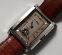 A GENTLEMAN'S FOSSIL WRISTWATCH with leather strap.