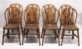 A SET OF EIGHT EARLY 20TH CENTURY BEECH AND ELM WHEELBACK DINING CHAIRS. 3ft 0ins hi9gh x 1ft 3ins