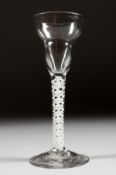 A GEORGIAN WINE GLASS with unusual shaped bowl and white air twist stem. 6ins high.