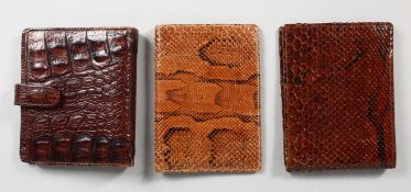 THREE CROCODILE AND SNAKESKIN WALLETS/NOTEBOOKS. 5ins wide