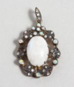 A GOLD MOONSTONE AND DIAMOND PENDANT.