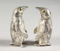 A PAIR OF .925 SILVER PLATE PENGUIN SALT AND PEPPERS.