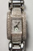 A SUPERB DIAMOND SET CHOPARD WRISTWATCH No. 41/8380 1093723 8357, in a Chopard box.