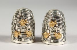 A PAIR OF .925 SILVER PLATE BEEHIVE SALT AND PEPPERS.