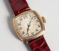 A LADIES' 9CT GOLD ROLEX WRISTWATCH No. 11883, with leather strap.
