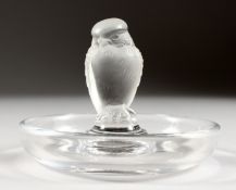 A LALIQUE BIRD CIRCULAR RING STAND. 3ins high.