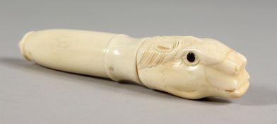 A CARVED BONE CORKSCREW AND ANVIL.