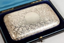 A GOOD VICTORIAN ENGRAVED SILVER CIGAR CASE in a blue case. Birmingham 1886. Maker C. C.