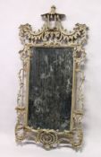 A CHINESE CHIPPENDALE REVIVAL PIER MIRROR, with pointed and parcel gilded carved frame. 5ft 4ins