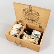 TWO MINIATURE BOTTLES OF SANDEMAN'S PORT in a wooden box.