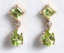 A PAIR OF 9CT GOLD, PERIDOT AND DIAMOND EARRINGS.