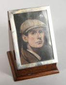 A WOODEN DESK BOX, the front with a silver photograph frame. 6ins x 4.5ins. Birmingham 1922.