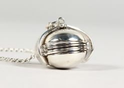 A SILVER FOLDING BALL LOCKET on a chain.