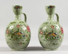 TWO COPELAND SPODE BOTTLE VASES, green leaf decorated ground with exotic birds (AF). 8.5ins high.