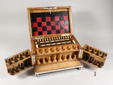 A SUPERB GAMES COMPENDIUM opening to reveal chess set, crib board, counters, cards etc. 13ins wide.