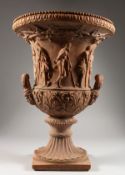 A GOOD TERRACOTTA TWO HANDLED GARDEN URN. 19ins high.