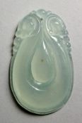 A CHINESE PALE CELADON JADE CARVED PENDANT. 2ins high.