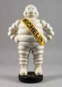 A CAST IRON AND PAINTED MODEL OF THE MICHELIN MAN.