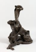 A BRONZE ABSTRACT GROUP, a pair of cheetahs.