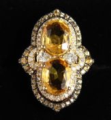 A SUPERB 18CT YELLOW GOLD TWO STONE YELLOW SAPPHIRE RING, approx. 2.4cts each, surrounded by small