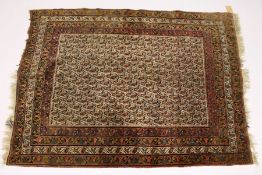 A PERSIAN RUG, early 20th Century, beige ground with a Boteh design, within a four row border. 5ft