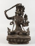 A THAI CAST METAL SEATED DEITY, holding a sword in her right hand. 12ins high.