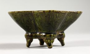 AN UNUSUAL CHINESE LOBED POTTERY SMALL BOWL. 4ins wide.