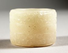 A CHINESE CARVED WHITE JADE ARCHER'S RING.