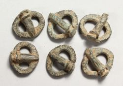 SIX SMALL ROMAN METAL BUCKLES.