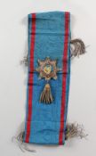 A BLUE SASH WITH CREST.