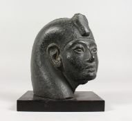 A LOUVRE COPY OF A PHARAOH on a marble base. 7ins high.