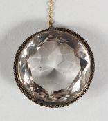 A LARGE CUT CIRCULAR CRYSTAL BROOCH.