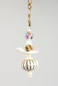 A VINTAGE DESIGNER RALPH MASSEY (born 1938) PORCELAIN FOB and chain.