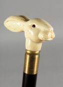 A WALKING STICK, the bone handle modelled as a rabbit. 36.5ins long.