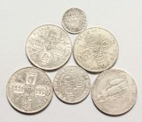 FOUR SILVER FLORINS, A VICTORIAN SHILLING AND A MAUNDY THREEPENCE.