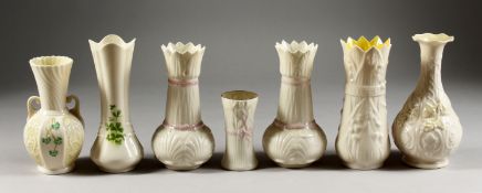 SEVEN VARIOUS IRISH BELLEEK VASES.