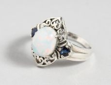 A SILVER SAPPHIRE AND GILSON OPAL RING.