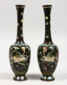 A SMALL PAIR OF JAPANESE CLOISONNE BOTTLE VASES. 7ins high.