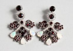 A GOOD PAIR OF SILVER, GARNET AND OPAL EARRINGS.