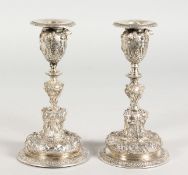 A PAIR OF PLAIN CAST CANDLESTICKS OF CLASSICAL DESIGN. 6.5ins high.