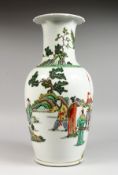 A LARGE CHINESE FAMILLE VERTE PORCELAIN VASE, painted with figures in a landscape. 17ins high.
