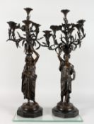 CHARLES CUMBERWORTH (1811-1852) A PAIR OF NUBIAN ORIENTALIST BRONZE CANDELABRA, cast as Nubian women