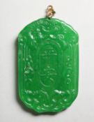 A CHINESE CARVED APPLE GREEN JADE PENDANT. 2.25ins high.