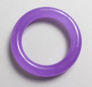 A PLAIN LAVENDER JADE BANGLE. 3.5ins diameter.