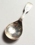 AN ENGRAVED FIDDLE PATTERN CADDY SPOON. Sheffield 1931.