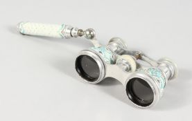 A SUPERB PAIR OF SEVRES PORCELAIN OPERA GLASSES with handle, the enamel painted with flowers.