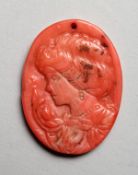 A SMALL RELIEF CARVED CORAL CAMEO PORTRAIT BUST OF A LADY. 1.5ins high.