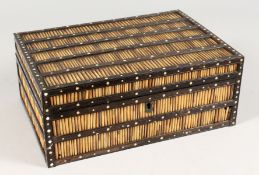 A CEYLONESE PORCUPINE QUILL BOX with fitted interior. 11ins wide.